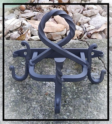 Wall mounted implement hanger - mounted,